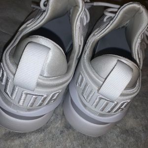 White PUMA sneakers